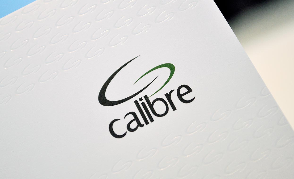 Calibre Global logo with clear foil pattern on a presentation folder